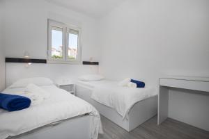 Posteľ alebo postele v izbe v ubytovaní Apartments BlueView