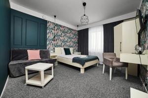 Posteľ alebo postele v izbe v ubytovaní Hotel Prowincja