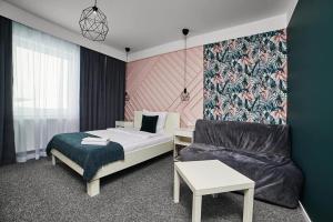 Llit o llits en una habitació de Hotel Prowincja