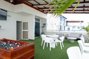 a room with a table and a chess board at Hotel Andy in Atacames