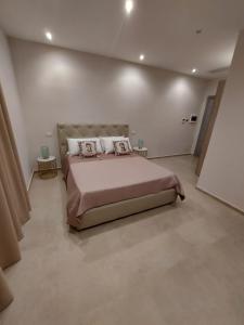 Postel nebo postele na pokoji v ubytování Masseria Torre Saracena