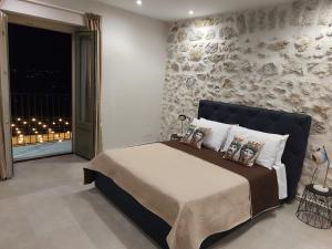 Postel nebo postele na pokoji v ubytování Masseria Torre Saracena