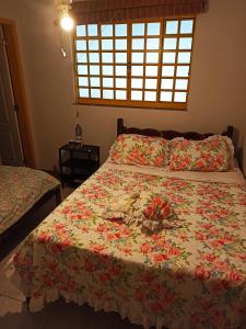 Uma cama ou camas num quarto em Sitio Sao Jeronimo