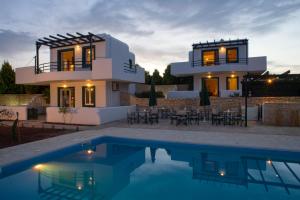 The swimming pool at or close to Cavo Plako Villas