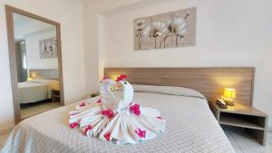 Postel nebo postele na pokoji v ubytování Hotel Residence Costa Azzurra