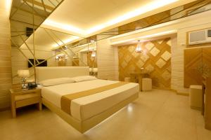 Voodi või voodid majutusasutuse Hotel Ava Cuneta toas