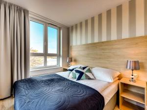 Posteľ alebo postele v izbe v ubytovaní Chrobry Apartamenty Gdańsk Grodzka 10
