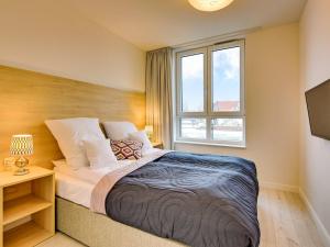 Posteľ alebo postele v izbe v ubytovaní Chrobry Apartamenty Gdańsk Grodzka 10
