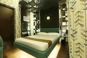 Ліжко або ліжка в номері Hotel Ava Gil Puyat