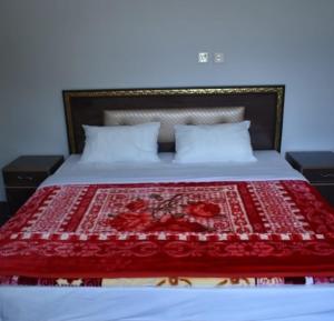 Ліжко або ліжка в номері Peace Land Hotel Hunza