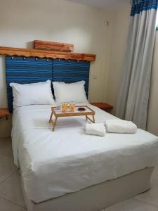 A bed or beds in a room at SMAG Suites