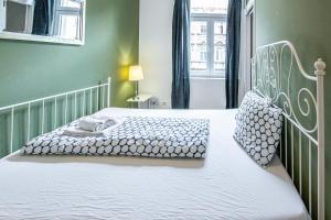 Tempat tidur dalam kamar di Viennese charm 2.0 by JR City Apartments