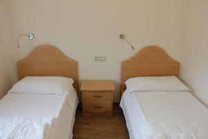 A bed or beds in a room at Residence Elettra