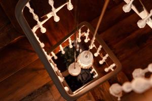 a group of shells are hanging from a ceiling at Santiago KM-0 in Santiago de Compostela