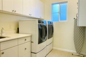 a kitchen with a washer and dryer in it at Entire 3 bedroom house for 6 people Near SFO SF Bay Area Newly updated in San Bruno