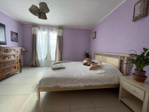 Katil atau katil-katil dalam bilik di Chambre d'hôte