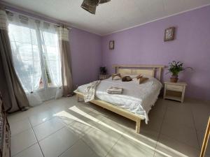 Katil atau katil-katil dalam bilik di Chambre d'hôte