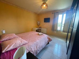 Katil atau katil-katil dalam bilik di Chambre d'hôte