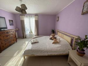 Katil atau katil-katil dalam bilik di Chambre d'hôte