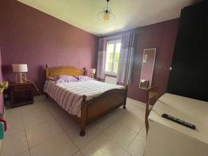 Katil atau katil-katil dalam bilik di Chambre d'hôte
