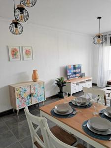 a dining room with a table and chairs at VeraTespera - Apartamento en Vera Playa - Mascotas in Vera