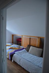 Llit o llits en una habitació de Baza Sportiva Adelina
