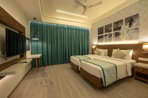 Cama ou camas em um quarto em The Avatar Hotel & Convention