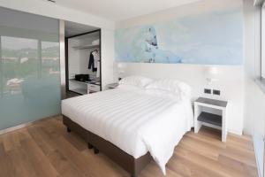 Postel nebo postele na pokoji v ubytování Life Hotel
