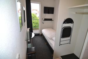 Postel nebo postele na pokoji v ubytování Hotel Bienvenue