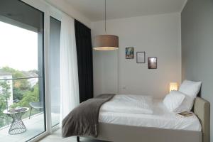 PM-AM Apartments GmbH tesisinde bir odada yatak veya yataklar