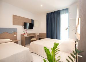 Posteľ alebo postele v izbe v ubytovaní Hotel Marconi Express