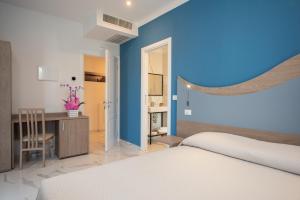 Posteľ alebo postele v izbe v ubytovaní Hotel Marconi Express