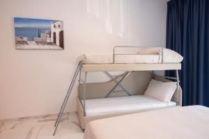 Posteľ alebo postele v izbe v ubytovaní Hotel Marconi Express