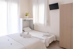 Posteľ alebo postele v izbe v ubytovaní Thalassenia Studios & Apartments 3