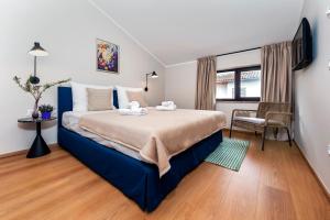 a bedroom with a large bed in a room at Sunset Residence Rovinj in Rovinj