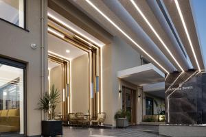 a lobby of a building with lights on the ceiling at Sapphire Blue Suites in Kissamos