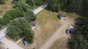 an aerial view of a camping site with a tent and cars at Camping Zvejnieksēta in Pāvilosta