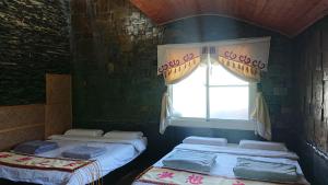 Uma cama ou camas num quarto em Wutai Dream-house