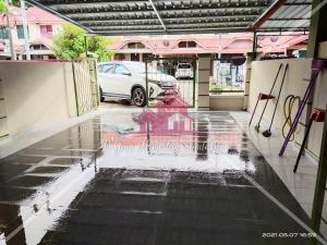 a parking lot with a car parked in a garage at D'Gaia Homestay Sandakan in Sandakan