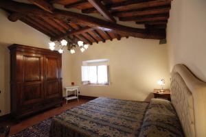 A bed or beds in a room at Residence Villa La Fornacina