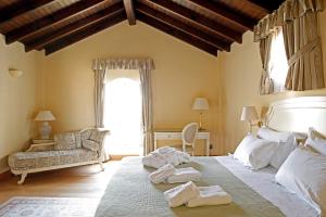 Postel nebo postele na pokoji v ubytování Siora Vittoria Boutique Hotel