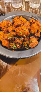 a plate of food sitting on a table at Grand Resort in Puri