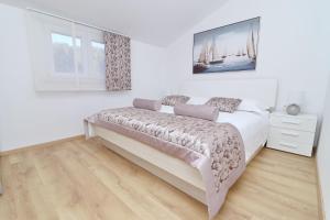 Postel nebo postele na pokoji v ubytování Villa Green Bay Apartments