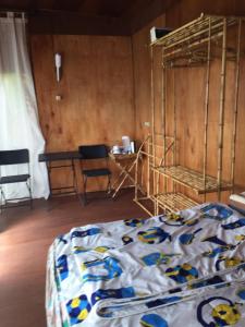 Postel nebo postele na pokoji v ubytování jungleadventure cabin camping