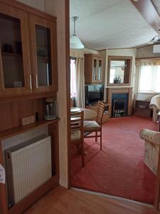 a room with a living room and a dining room at Ubytování Levandule in Košín