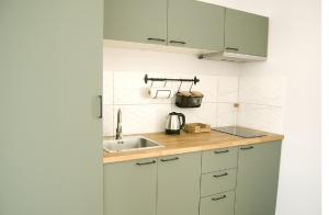 A kitchen or kitchenette at Apartament Jeziorna 11a