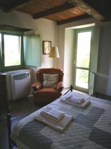 A bed or beds in a room at La Corte del Borgo