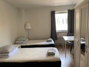 Postel nebo postele na pokoji v ubytování Helsingborgs Vandrarhem, Helsingborg Hostel