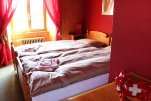 Postel nebo postele na pokoji v ubytování Auberge de l'Ange