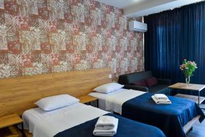 Voodi või voodid majutusasutuse Tskaltubo Epic Hotel & Spa toas